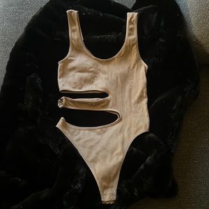 Tan body suit size M/L , never worn, the quality is very good. Slim fit